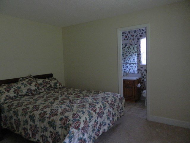 1625 Nowell Road West Macon, GA 31220 - Photo 18 of 21 a bedroom with a bed and a window