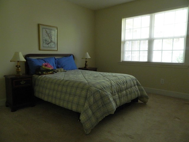 1625 Nowell Road West Macon, GA 31220 - Photo 19 of 21 a bed sitting in a bedroom next to a window