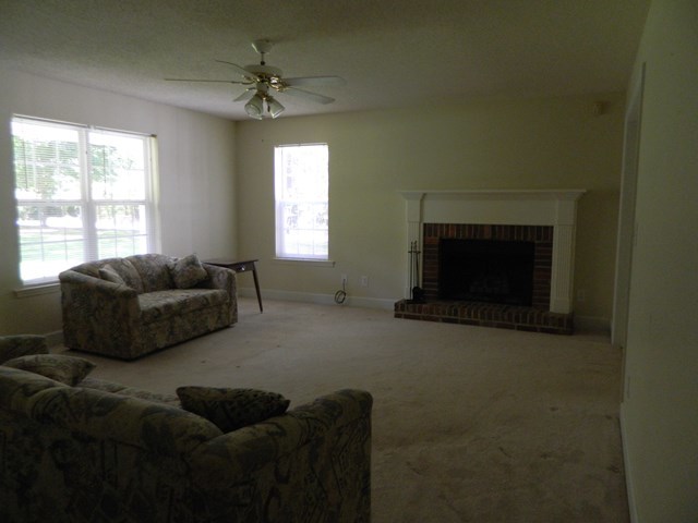 1625 Nowell Road West Macon, GA 31220 - Photo 10 of 21 a living room with furniture a fireplace and a window