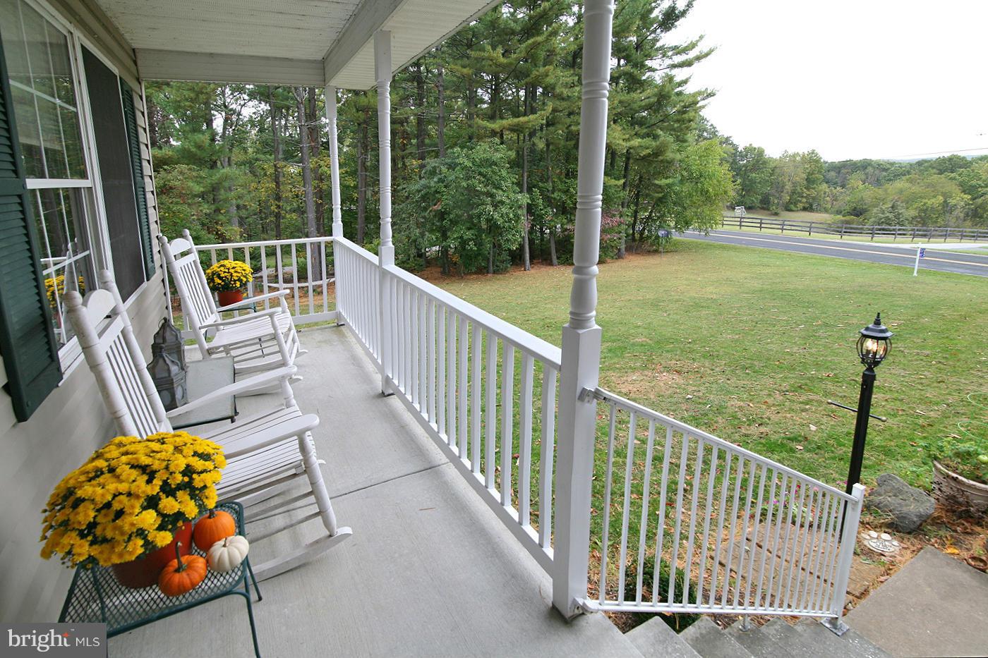 1007 Stone Road Westminster, MD 21158 - Photo 2 of 28 Covered porch overlooking farmland.