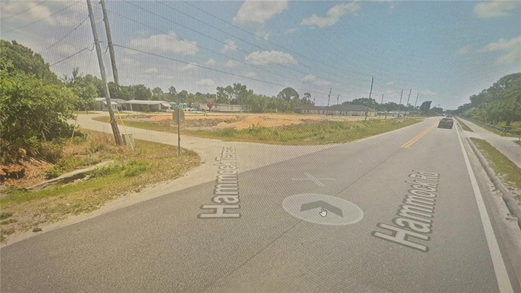 2630 Hammock Road Sebring, FL 33870 - Photo 4 of 8 a view of a swimming pool with an ocean view