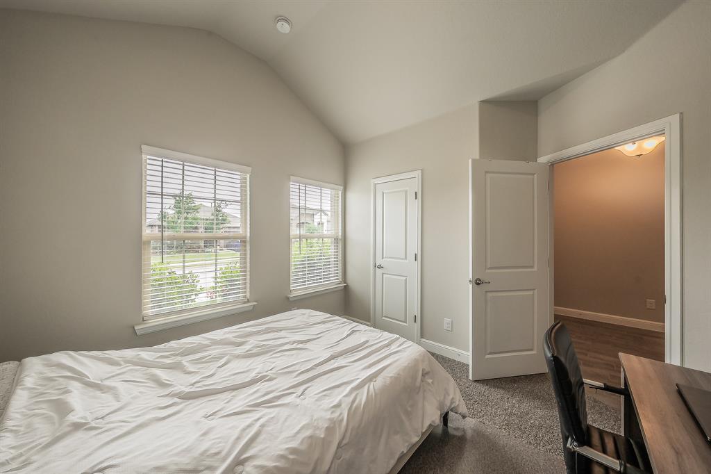 1212 Bosque Lane Weatherford, TX 76087 - Photo 21 of 38 a bedroom with a bed and a window