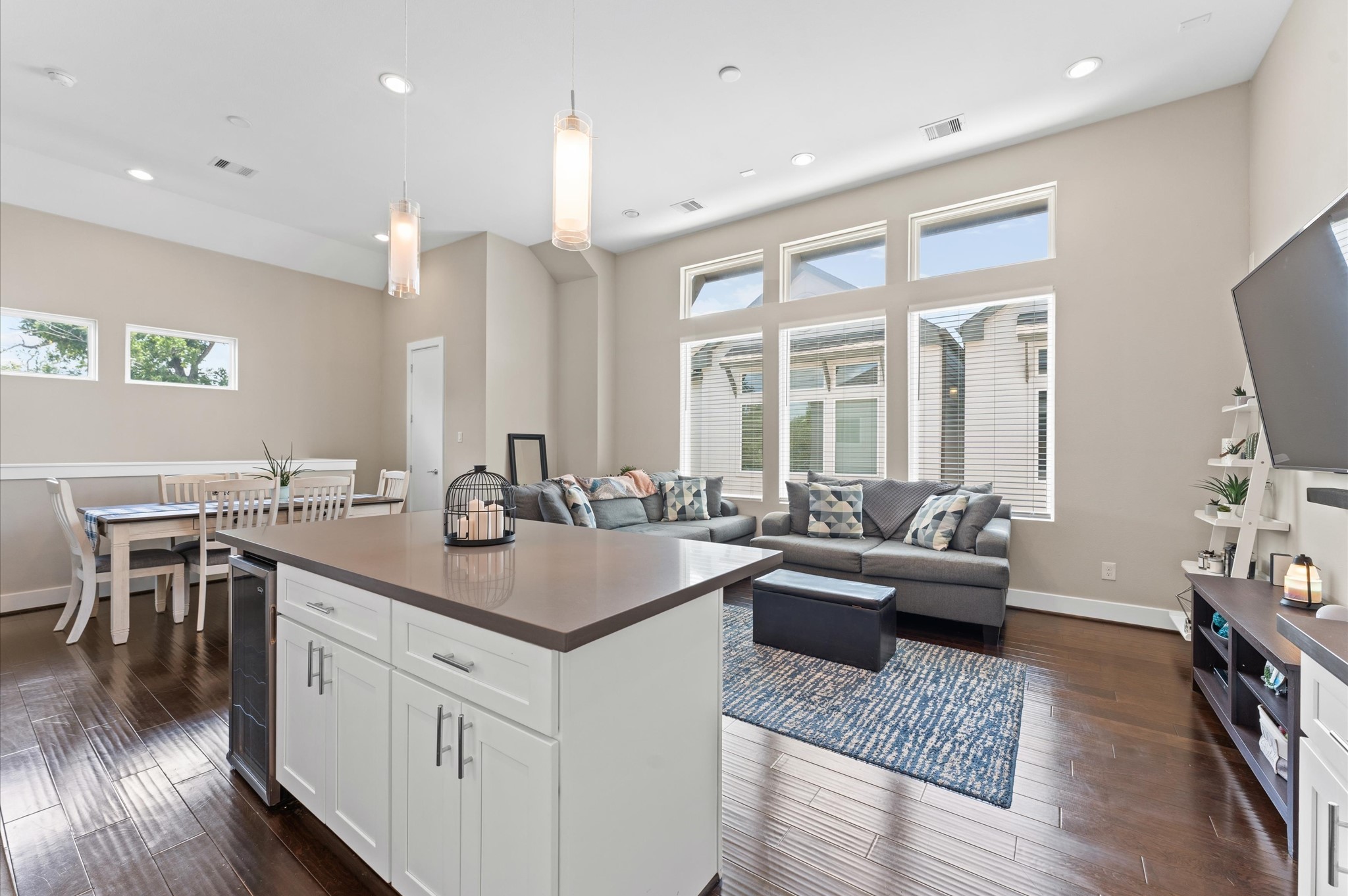 2422 Cochran Street Houston, TX 77009 - Photo 12 of 31 A wall of windows provides ample natural light to the living space as well. There is a convenient half bath in the far left corner.