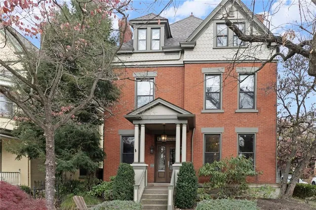 front view of a house with a small yard