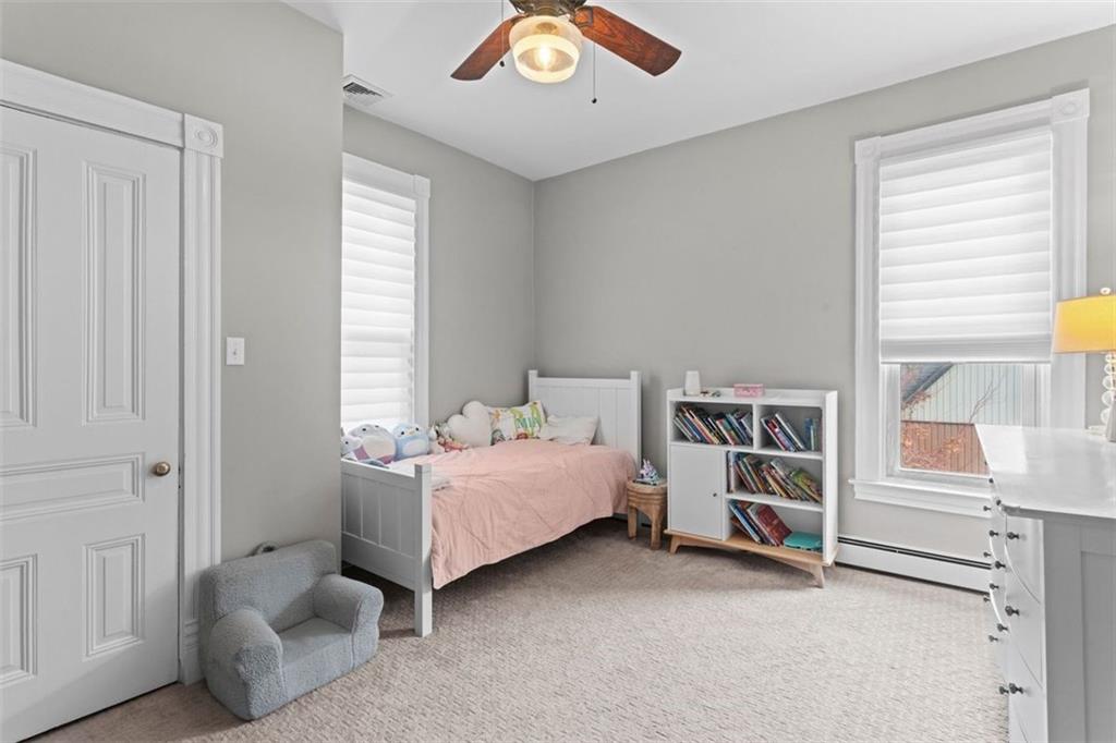 719 College Street Pittsburgh, PA 15232 - Photo 23 of 50 a bedroom with a bed and a book shelf