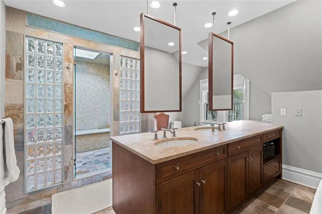 a bathroom with a sink and a mirror