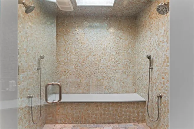 a view of bathroom with a shower and a bath tub