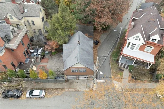 a living room with furniture and a lamp