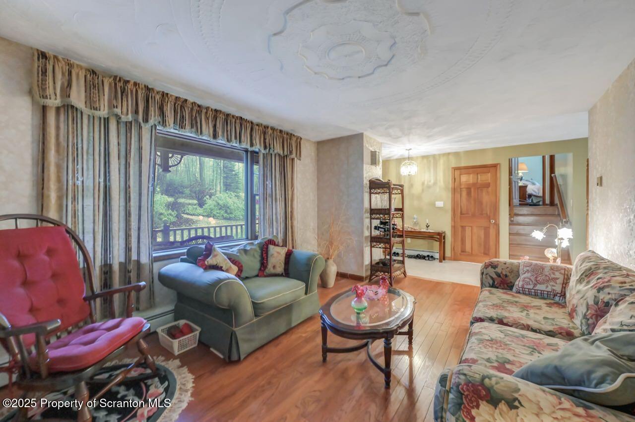 99 Main Street Gouldsboro, PA 18424 - Photo 11 of 79 a living room with furniture and a large window