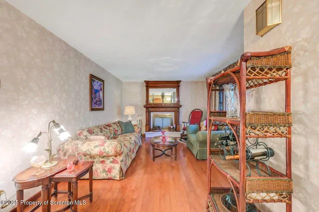 a living room with furniture and a lamp