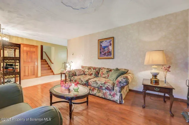 a kitchen with stainless steel appliances granite countertop a refrigerator a stove and a sink with cabinets