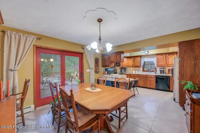 a kitchen with stainless steel appliances kitchen island granite countertop a sink and cabinets