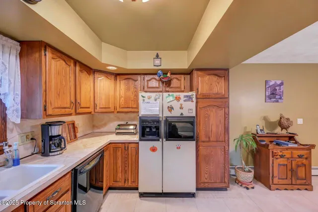 a bedroom with bed and wooden floor