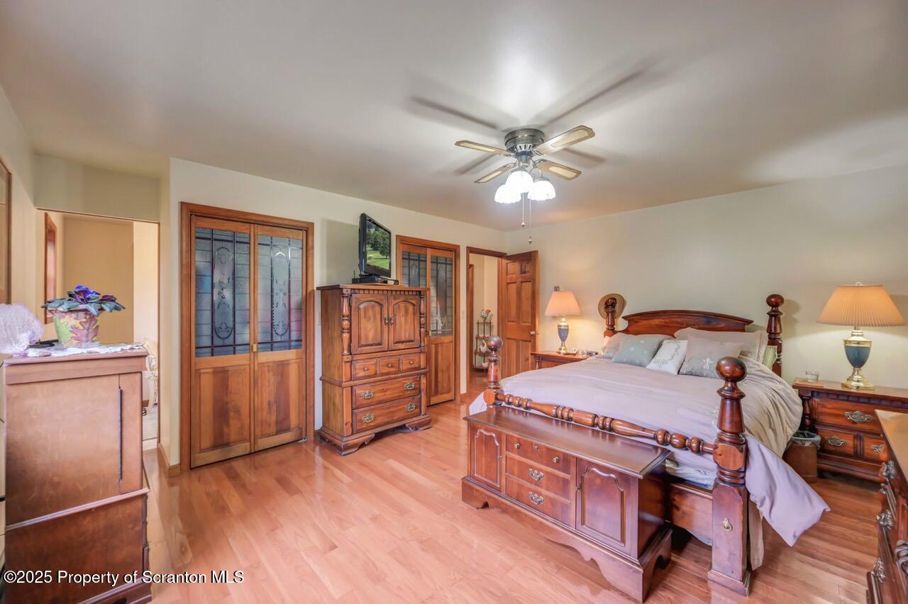 99 Main Street Gouldsboro, PA 18424 - Photo 33 of 79 a bedroom with a bed and wooden floor