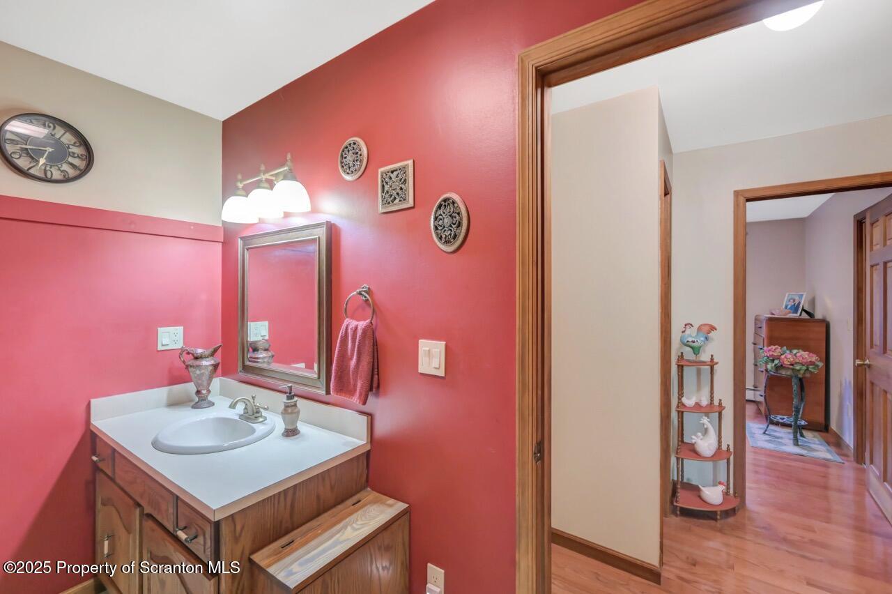 99 Main Street Gouldsboro, PA 18424 - Photo 40 of 79 a bathroom with a sink a mirror and a window