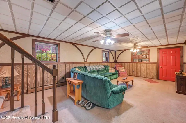 a view of a house with pool and sitting area