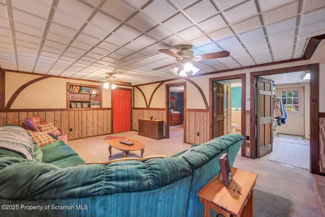 a front view of a house with a yard and trees