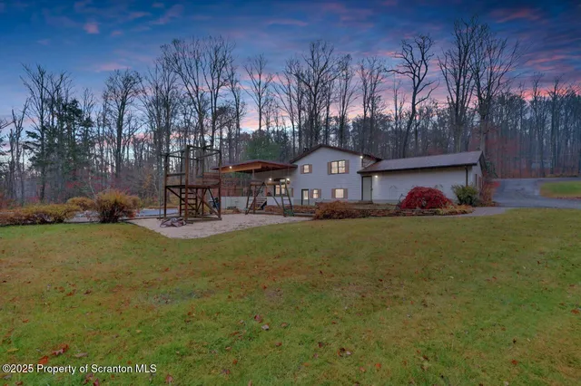 a childrens park with lots of swings and slides