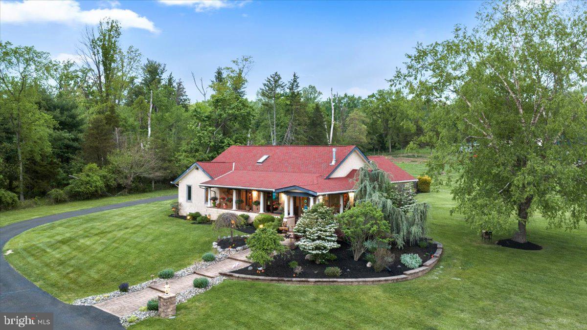 1121 Swamp Road Furlong, PA 18925 - Photo 1 of 50 Charming home amidst lush greenery.