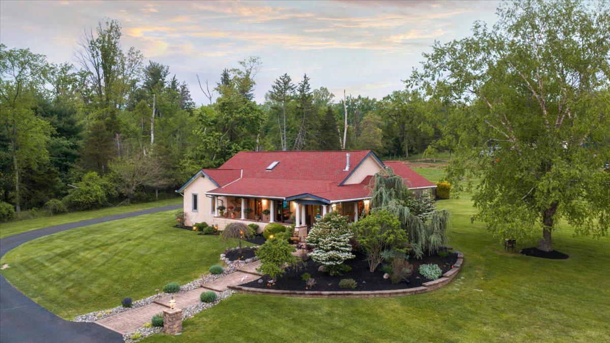 1121 Swamp Road Furlong, PA 18925 - Photo 2 of 50 Lush greenery surrounds this custom home
