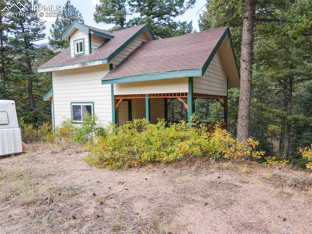 4950 Little Turkey Creek Road Colorado Springs, CO 80926 - Photo 2 of 33 a front view of a house with a yard