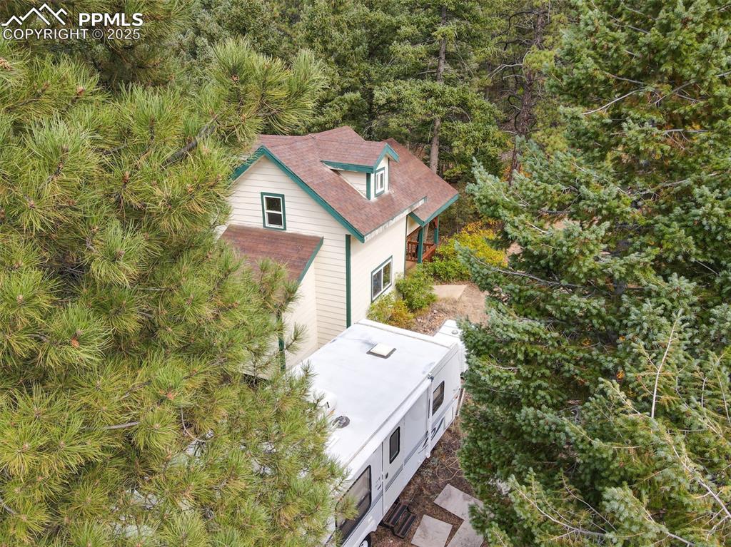 4950 Little Turkey Creek Road Colorado Springs, CO 80926 - Photo 4 of 33 view of a house with a yard