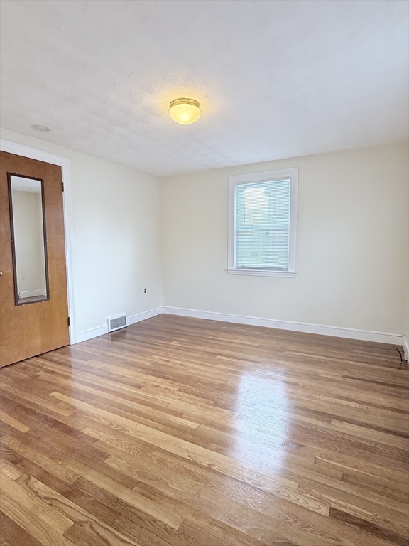 188 Lexington Street Newton, MA 02466 - Photo 6 of 12 a view of empty room and wooden floor