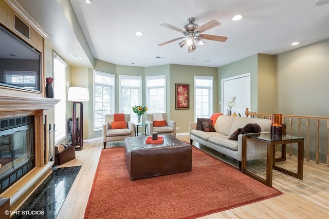 1443 North Mohawk Street, Unit 3 Chicago, IL 60610 - Photo 2 of 16 a living room with furniture and a fireplace