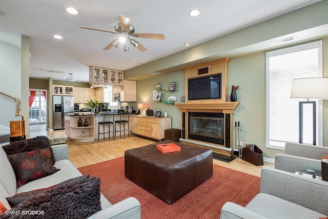 1443 North Mohawk Street, Unit 3 Chicago, IL 60610 - Photo 5 of 16 a living room with furniture and a fireplace