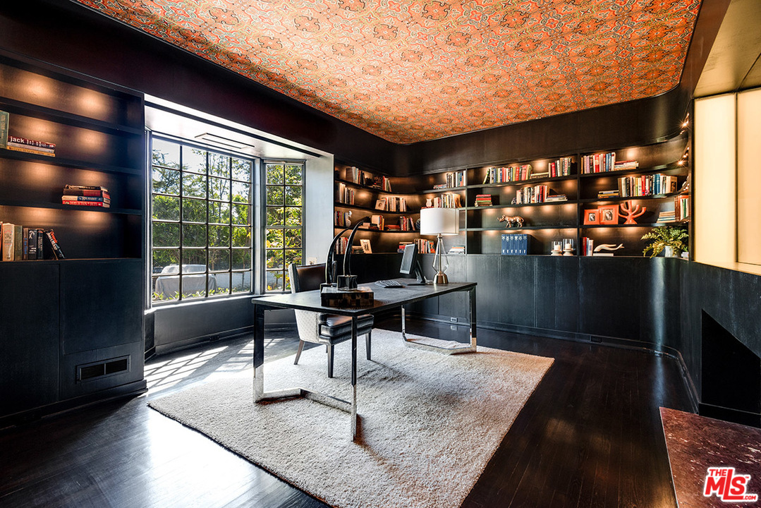 243 Delfern Drive Los Angeles, CA 90077 - Photo 13 of 32 a living room with furniture and a large window