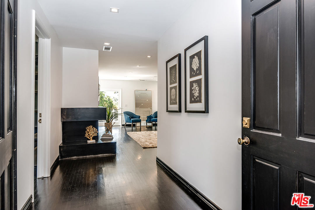 243 Delfern Drive Los Angeles, CA 90077 - Photo 14 of 32 a living room with furniture and a fireplace