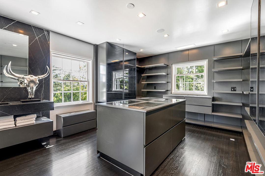 243 Delfern Drive Los Angeles, CA 90077 - Photo 20 of 32 a kitchen with a stove and a window