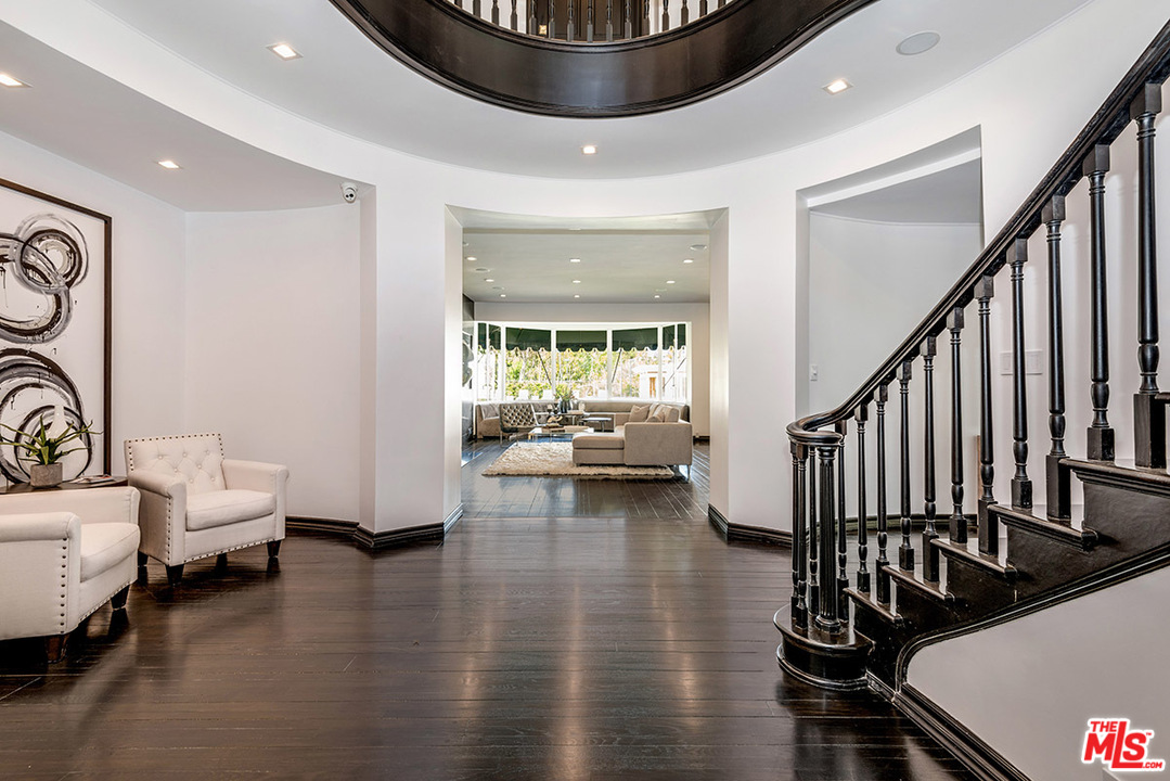 243 Delfern Drive Los Angeles, CA 90077 - Photo 2 of 32 a very nice looking room with wooden floor and a rug