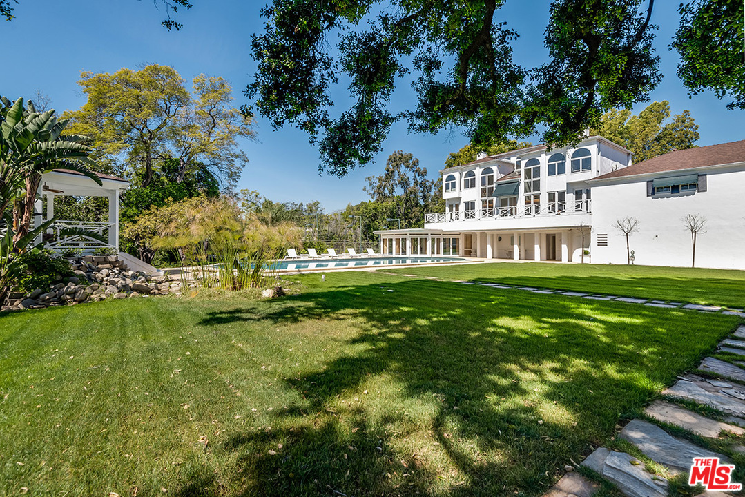 243 Delfern Drive Los Angeles, CA 90077 - Photo 26 of 32 a view of house with a big yard