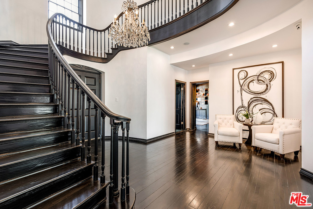 243 Delfern Drive Los Angeles, CA 90077 - Photo 3 of 32 a view of entryway and hall with wooden floor