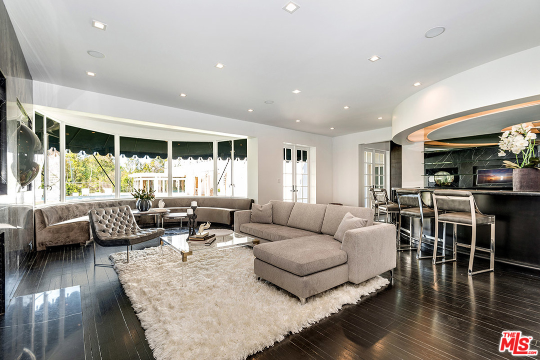 243 Delfern Drive Los Angeles, CA 90077 - Photo 5 of 32 a living room with furniture and a large window