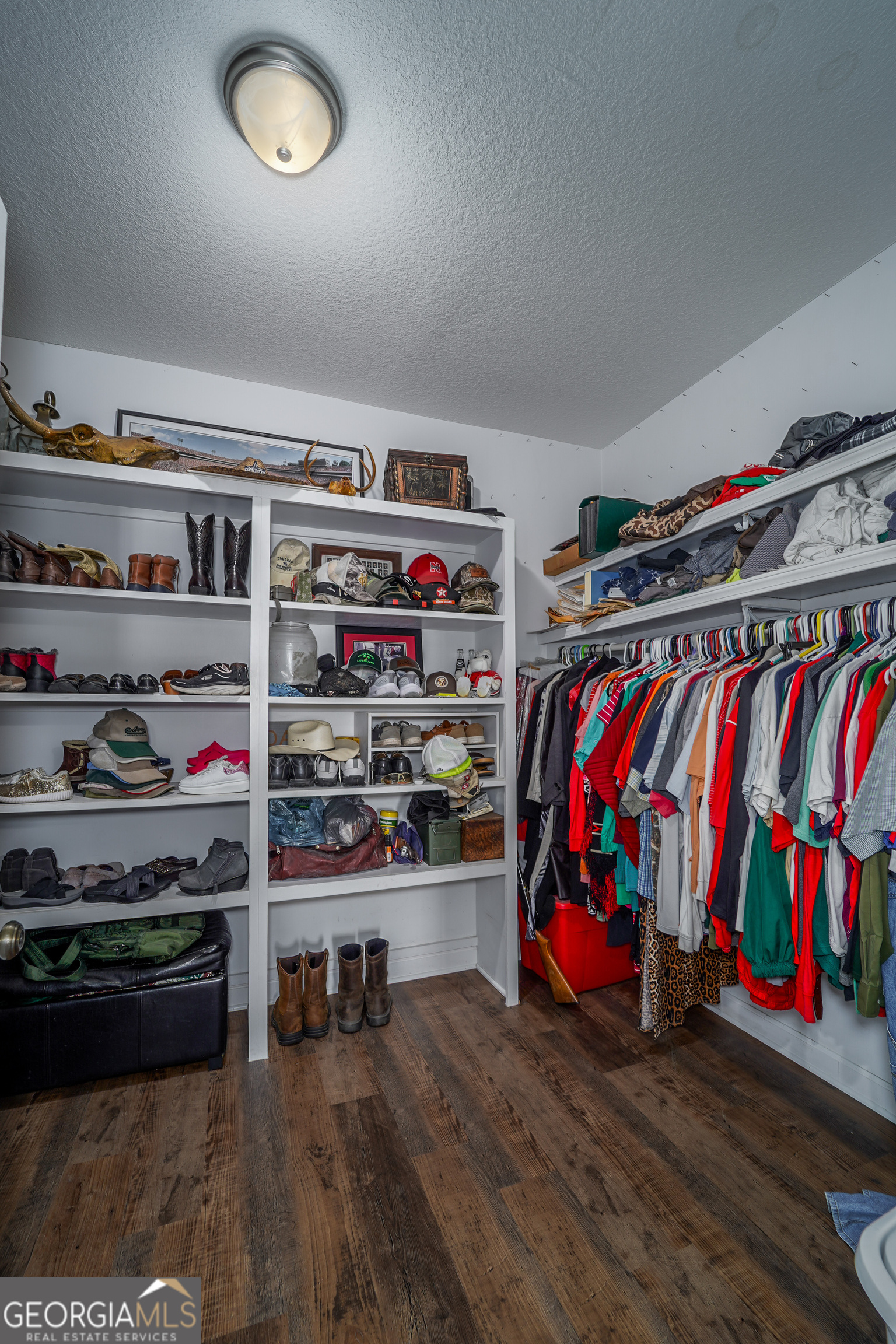 3300 Connor Lane Waycross, GA 31503 - Photo 34 of 42 a view of walk in closet with clothes and shoes
