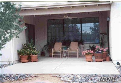 1 East Desert Sky Road, Unit 15 Tucson, AZ 85737 - Photo 2 of 6 a living room with furniture and a potted plant