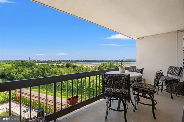 a view of a chairs and table in patio