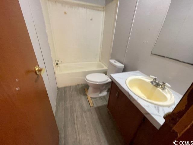 344 Sonny Road Gresham, SC 29546 - Photo 11 of 14 Bathroom featuring vanity, toilet, and wood-type f