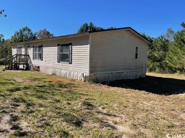 344 Sonny Road Gresham, SC 29546 - Photo 3 of 14 View of property exterior with a yard