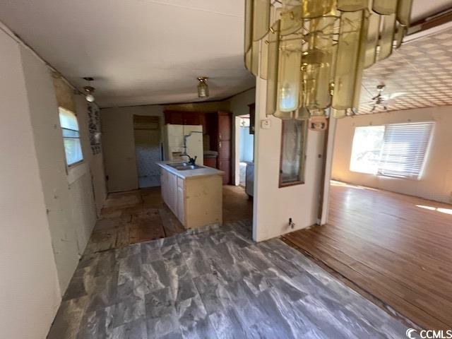 344 Sonny Road Gresham, SC 29546 - Photo 4 of 14 Kitchen featuring dark wood-type flooring, a cente