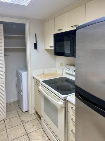 a kitchen with a stove and a microwave