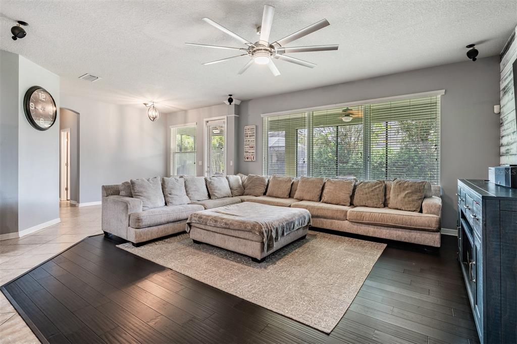 6908 Covington Stone Avenue Apollo Beach, FL 33572 - Photo 16 of 60 a living room with furniture and a large window
