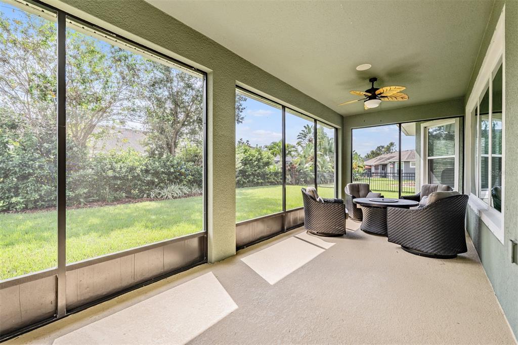 6908 Covington Stone Avenue Apollo Beach, FL 33572 - Photo 32 of 60 a living room filled with furniture and a large window