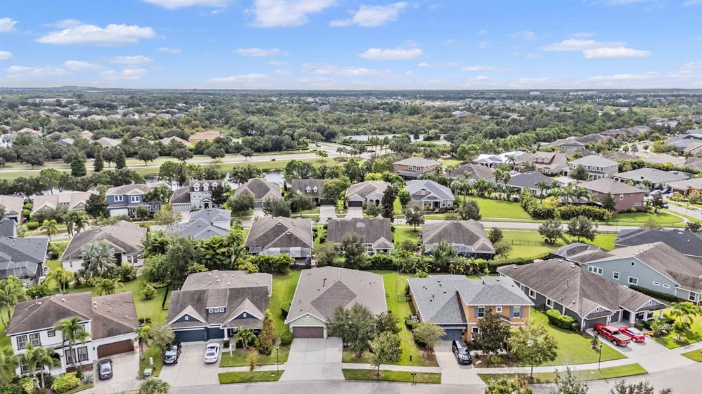 6908 Covington Stone Avenue Apollo Beach, FL 33572 - Photo 36 of 60 an aerial view of residential houses with outdoor space