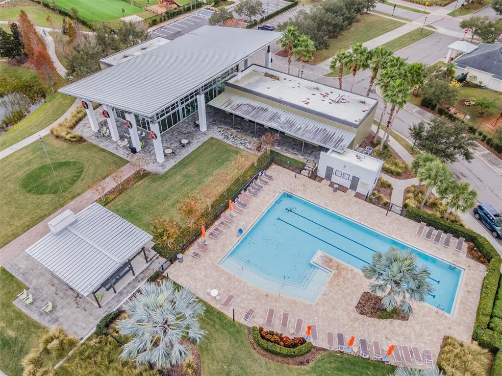6908 Covington Stone Avenue Apollo Beach, FL 33572 - Photo 49 of 60 an aerial view of a house with a garden