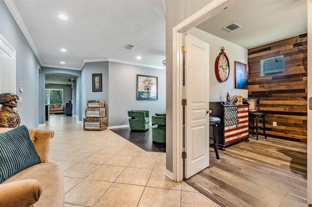 6908 Covington Stone Avenue Apollo Beach, FL 33572 - Photo 7 of 60 a kitchen with stainless steel appliances granite countertop a refrigerator and a stove top oven