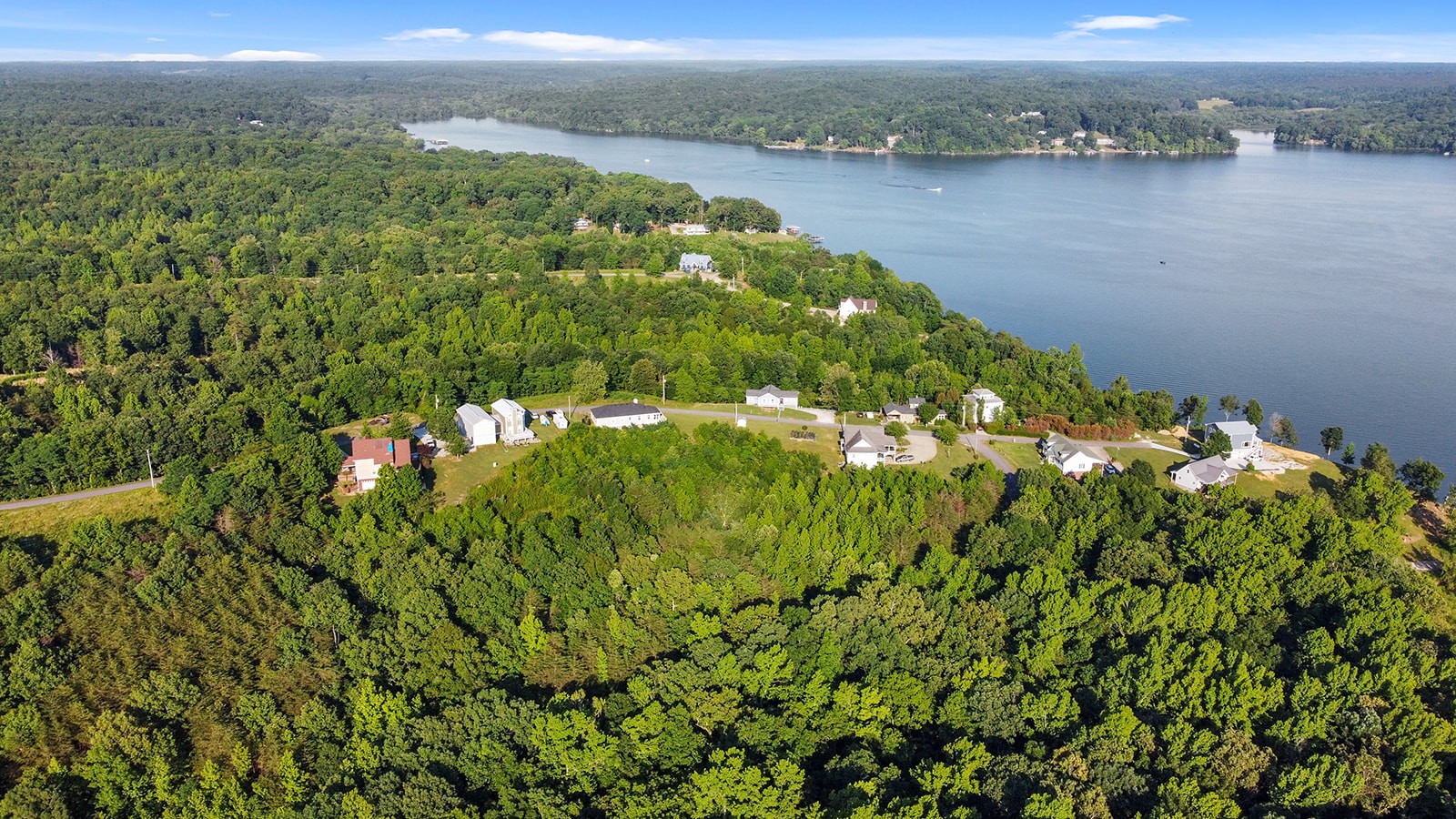 465 Turtle Point Lane Waverly, TN 37185 - Photo 11 of 49 a view of a lake with a field