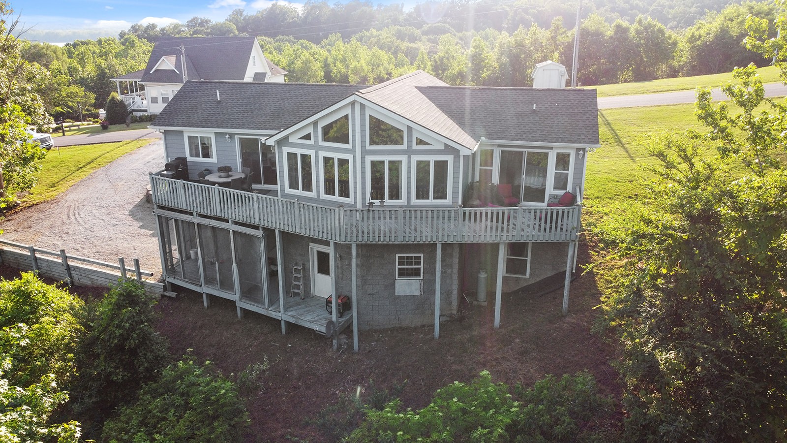 465 Turtle Point Lane Waverly, TN 37185 - Photo 15 of 49 a view of a house with a yard and potted plants